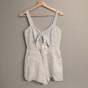 Seersucker romper with bow and cutout detail